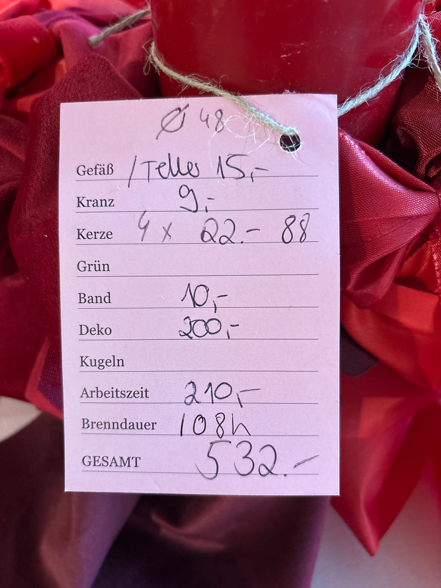 Advent wreath with red velvet bows