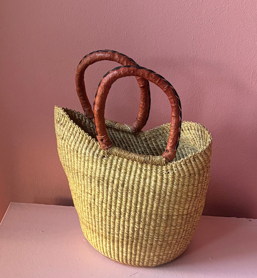 Orange basket bag with leather handles