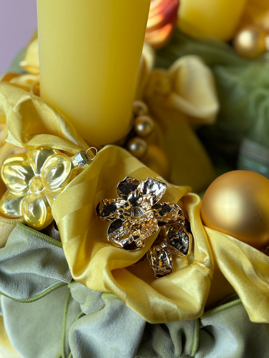 Advent wreath with yellow-green velvet bows and baubles