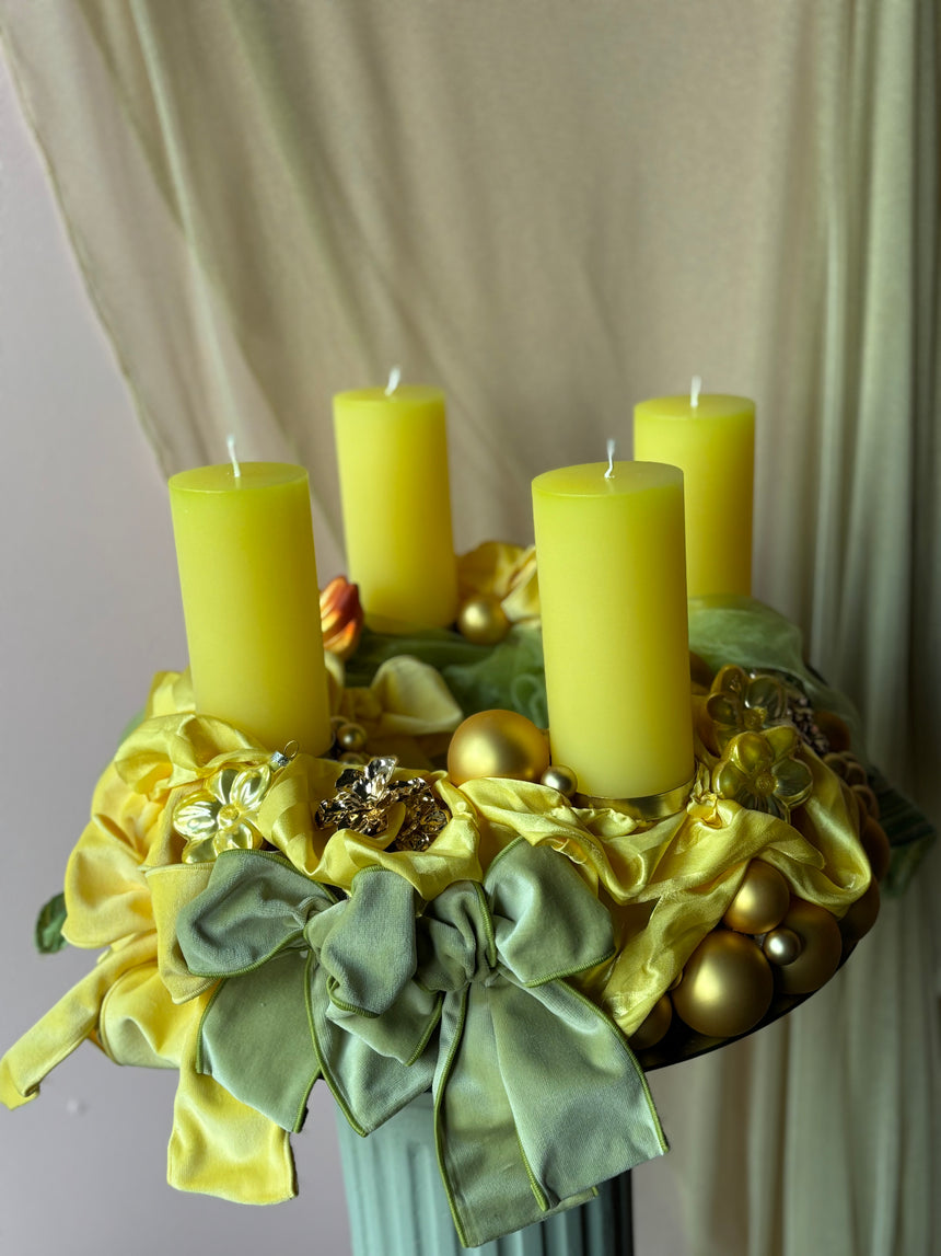 Advent wreath with yellow-green velvet bows and baubles