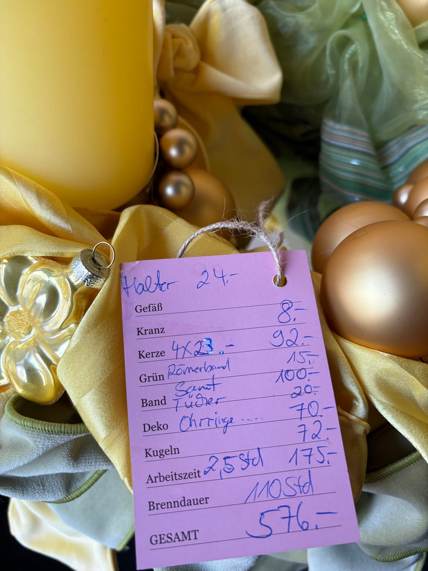 Advent wreath with yellow-green velvet bows and baubles